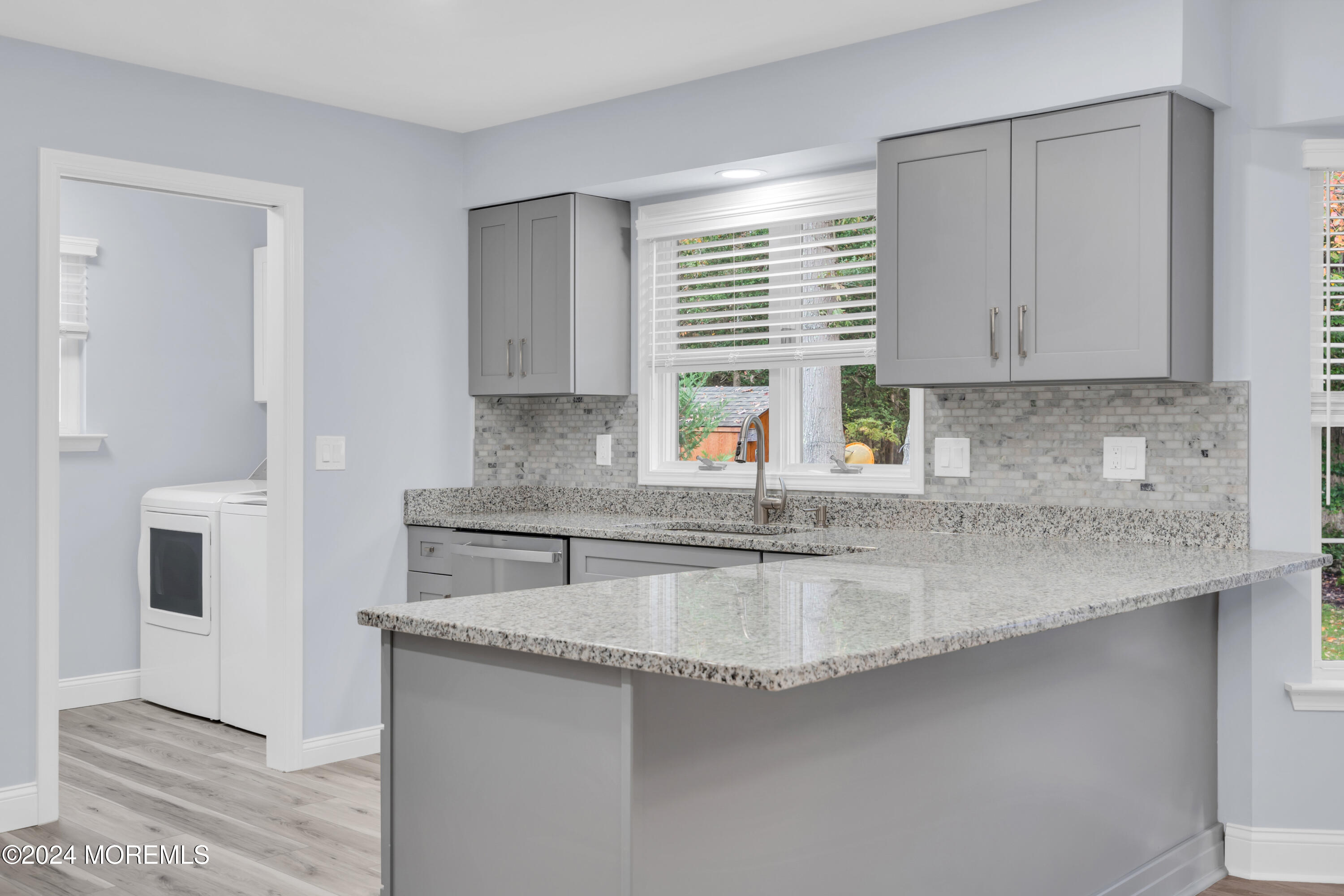 239 Sunset Drive Forked River, NJ 08731 - Photo 10 of 35 a kitchen with stainless steel appliances granite countertop a sink a stove and a refrigerator