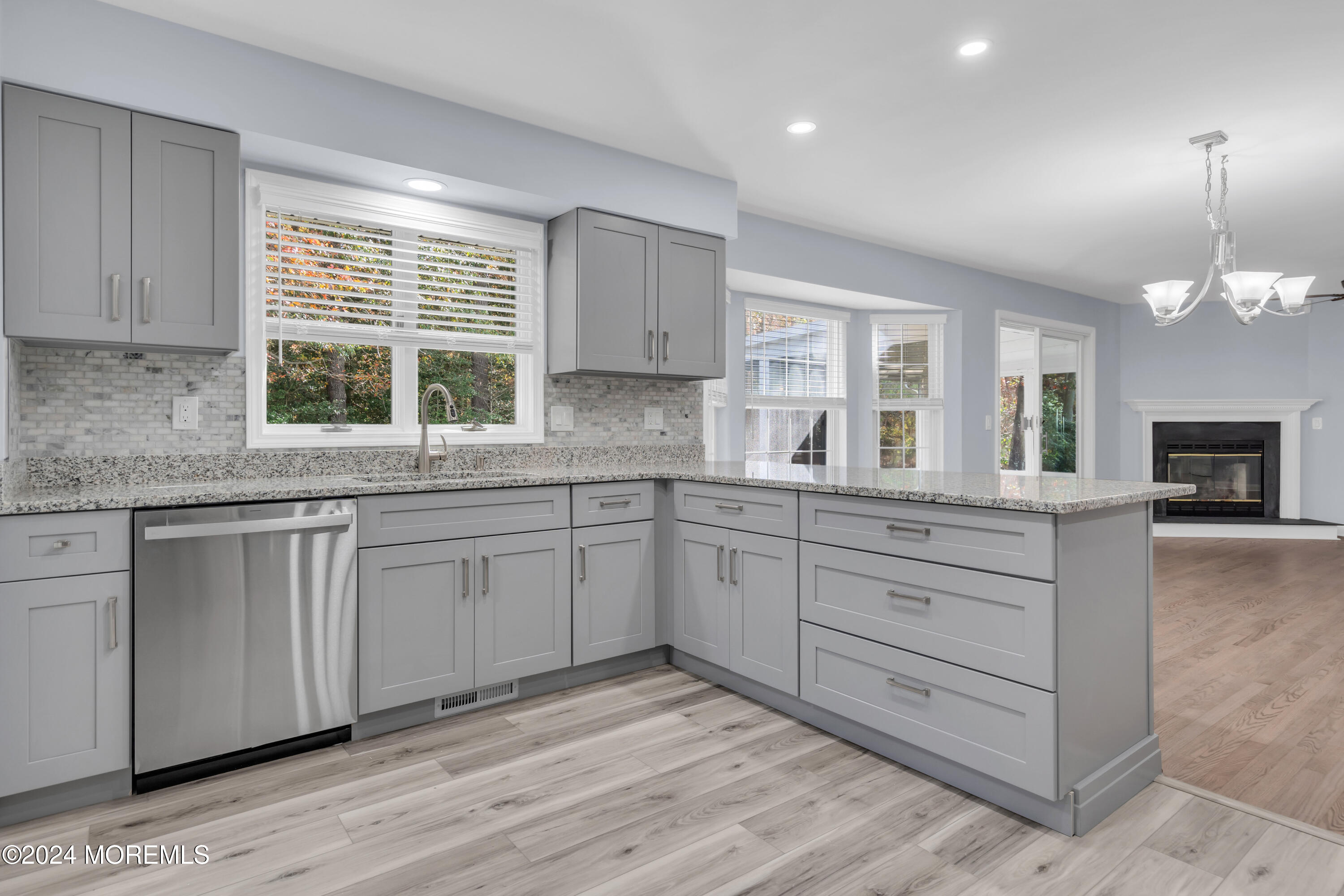239 Sunset Drive Forked River, NJ 08731 - Photo 11 of 35 a kitchen with granite countertop white cabinets and a large window