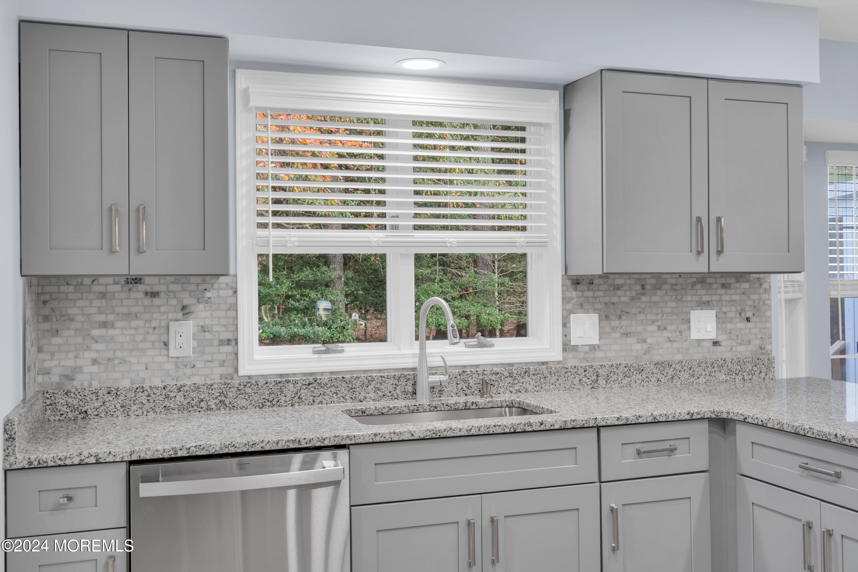 239 Sunset Drive Forked River, NJ 08731 - Photo 14 of 35 a kitchen with granite countertop white cabinets and a window