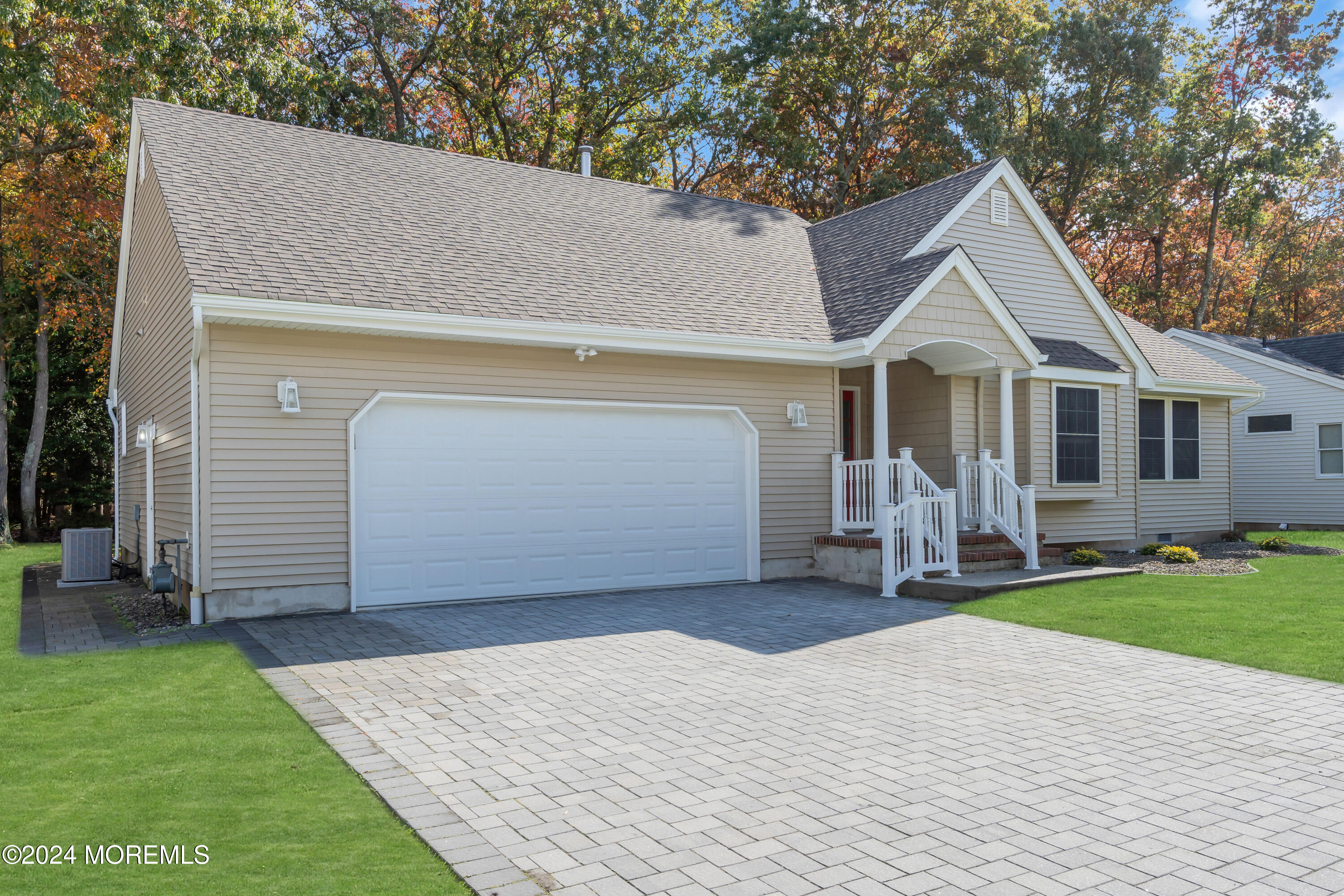 239 Sunset Drive Forked River, NJ 08731 - Photo 2 of 35 a front view of a house with a yard and garage