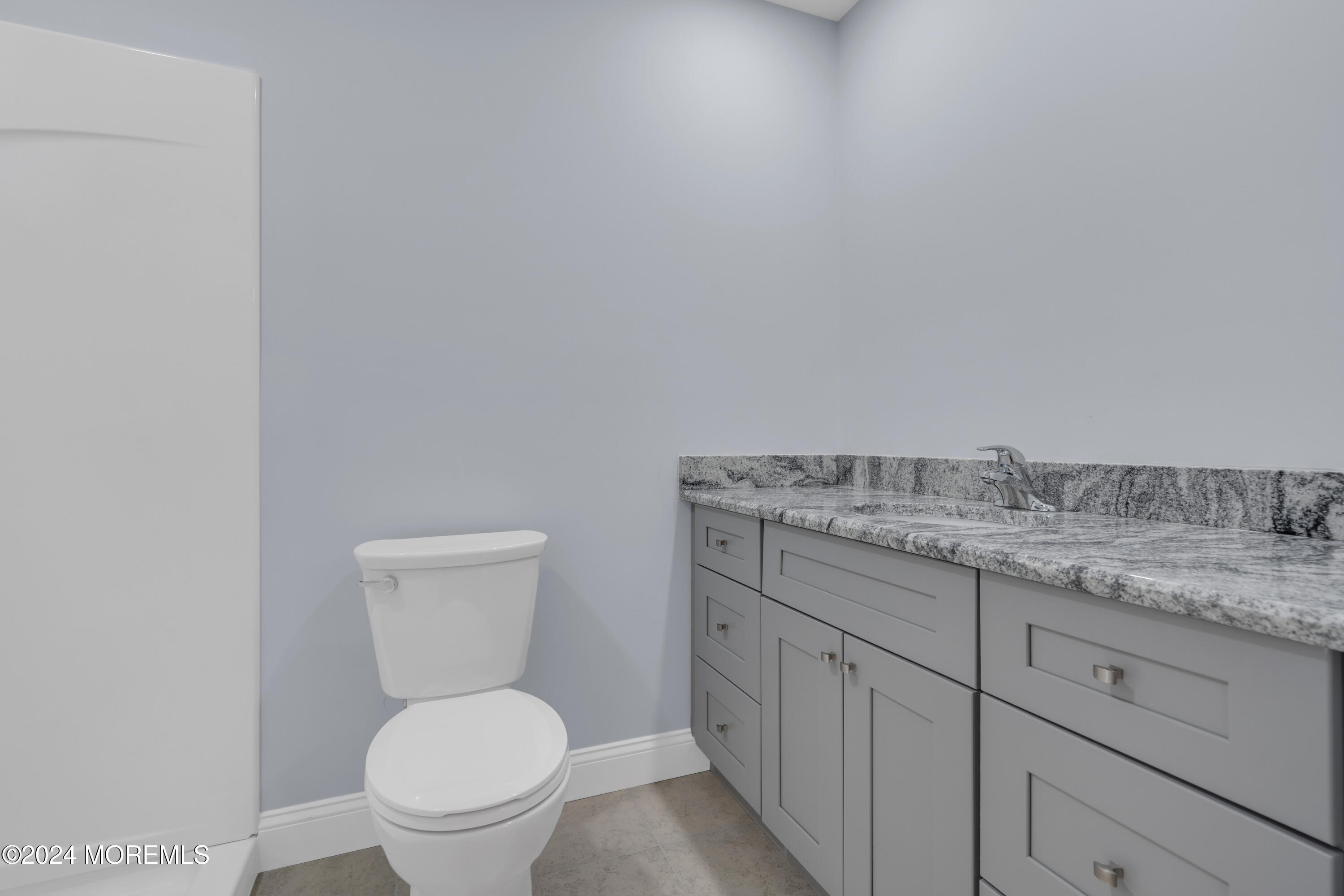 239 Sunset Drive Forked River, NJ 08731 - Photo 24 of 35 a bathroom with a granite countertop toilet and a sink