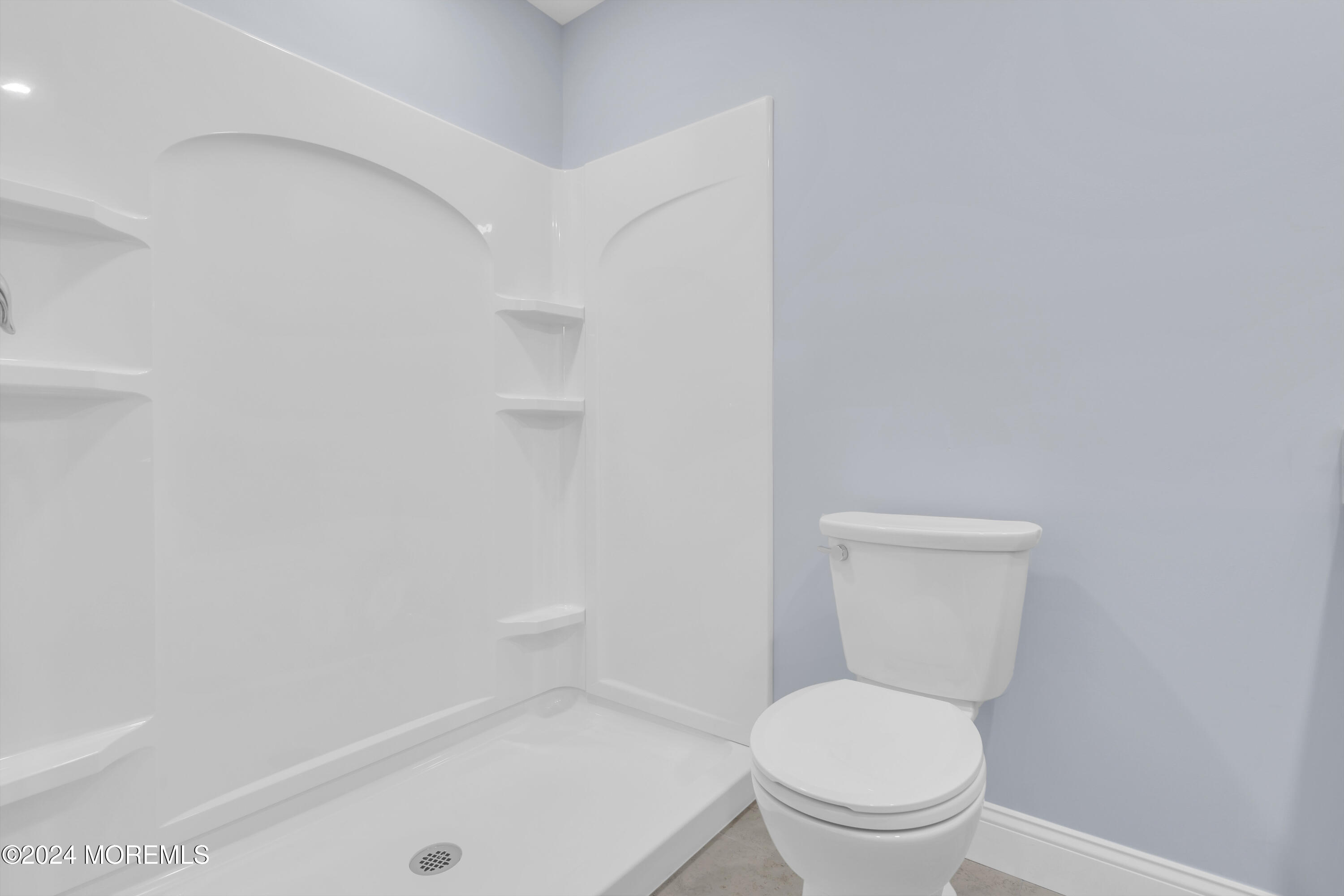 239 Sunset Drive Forked River, NJ 08731 - Photo 25 of 35 a white toilet sitting next to a bath tub