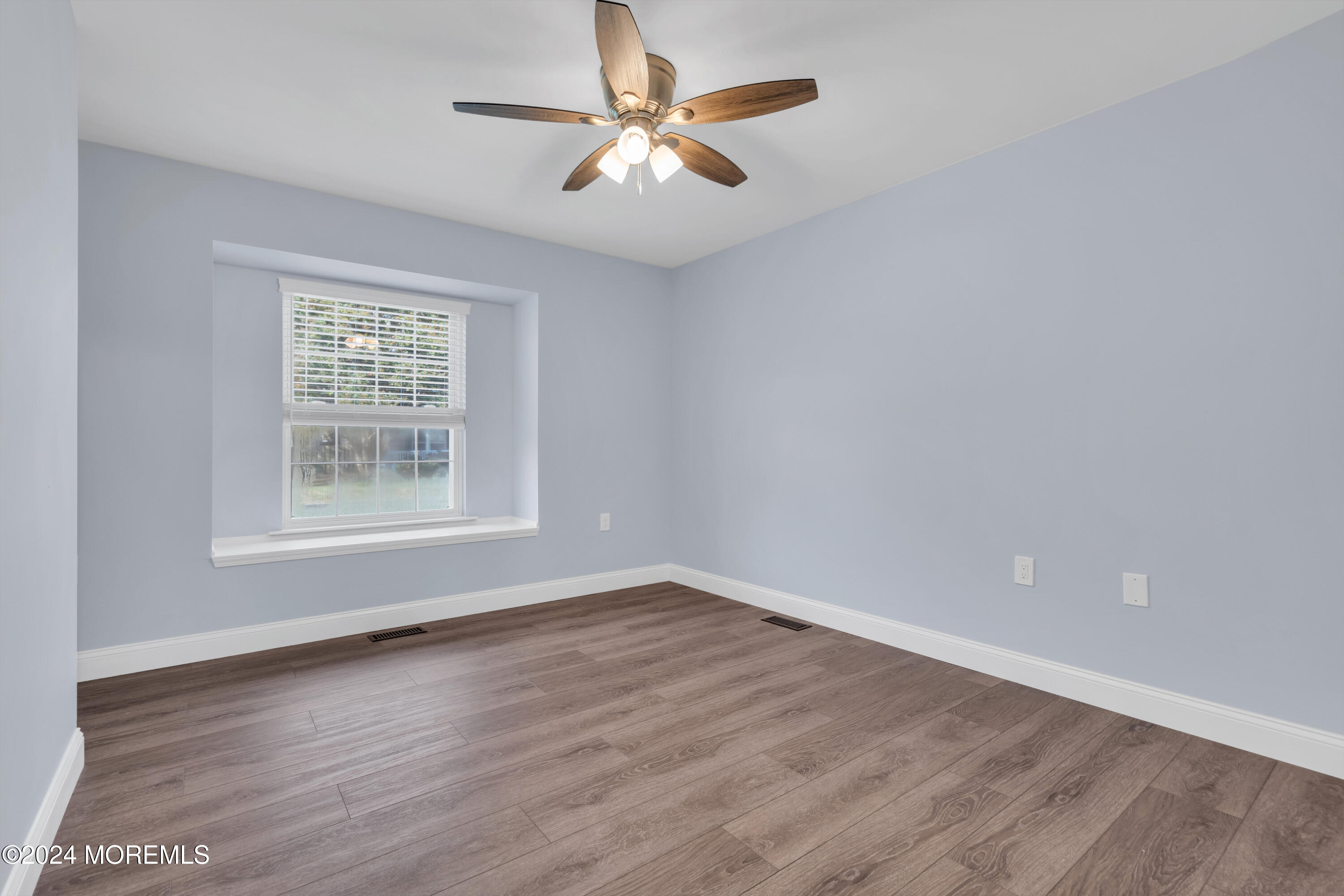239 Sunset Drive Forked River, NJ 08731 - Photo 27 of 35 wooden floor in an empty room with a window