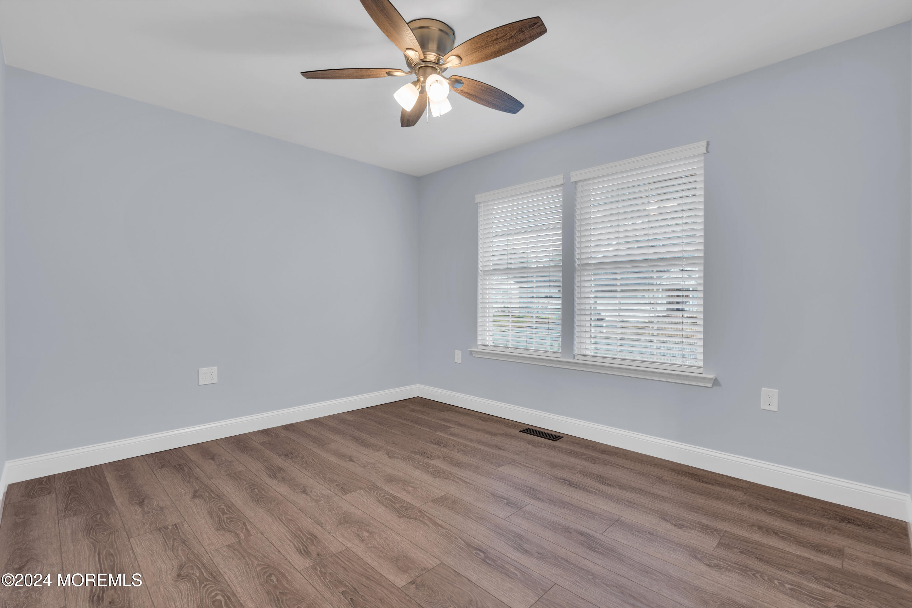 239 Sunset Drive Forked River, NJ 08731 - Photo 28 of 35 wooden floor in an empty room with a window