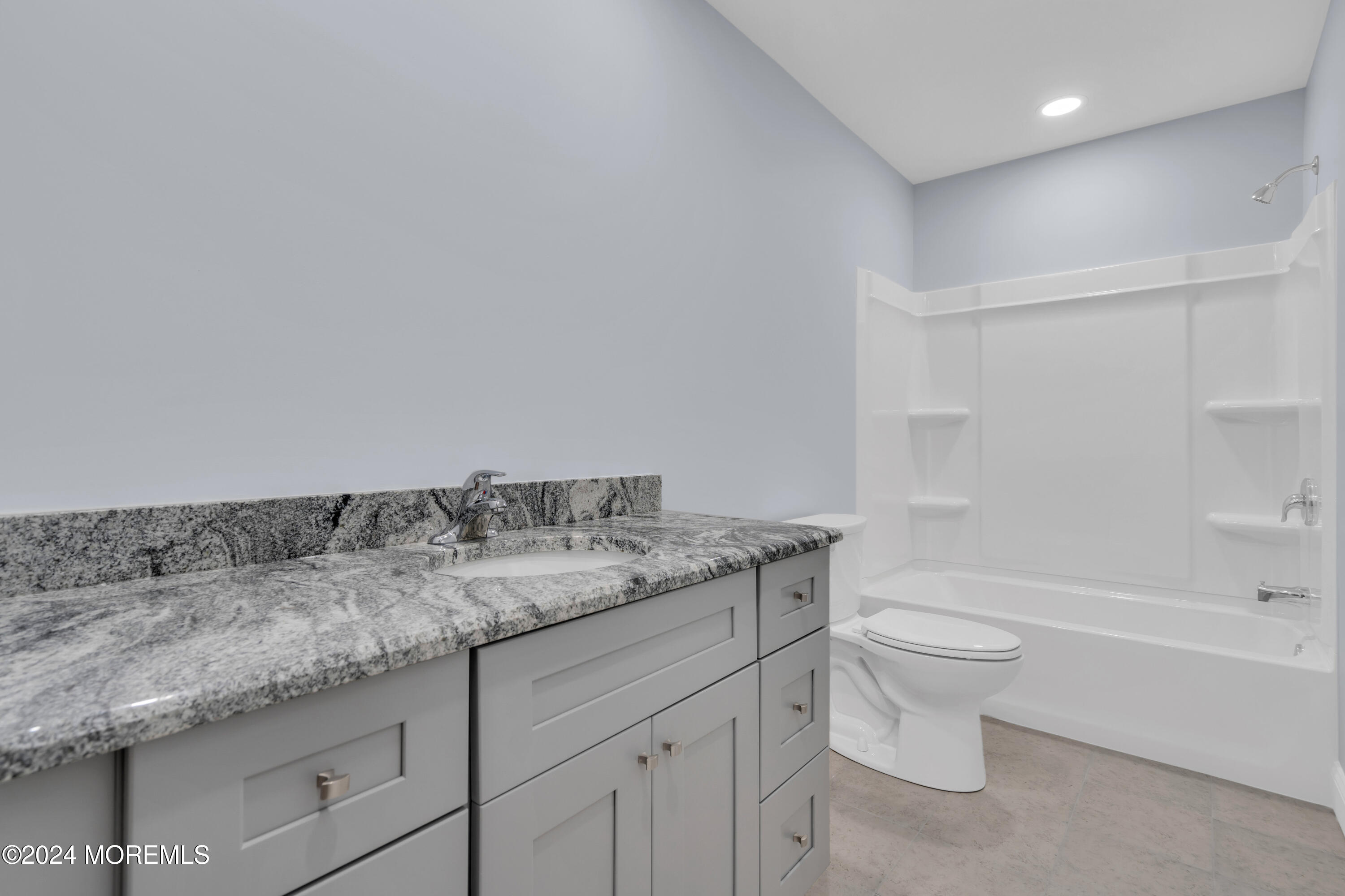 239 Sunset Drive Forked River, NJ 08731 - Photo 29 of 35 a bathroom with a granite countertop sink a toilet and bathtub