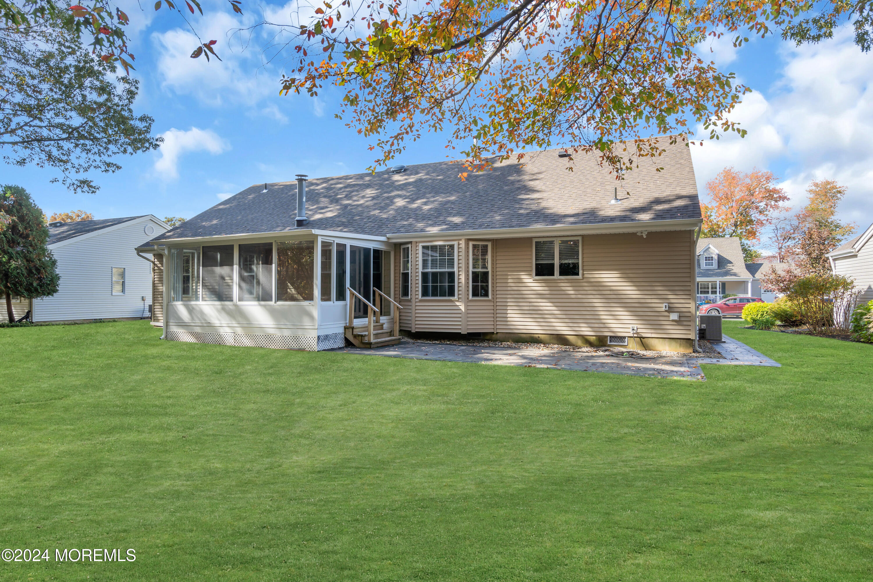 239 Sunset Drive Forked River, NJ 08731 - Photo 32 of 35 a front view of a house with a garden and trees