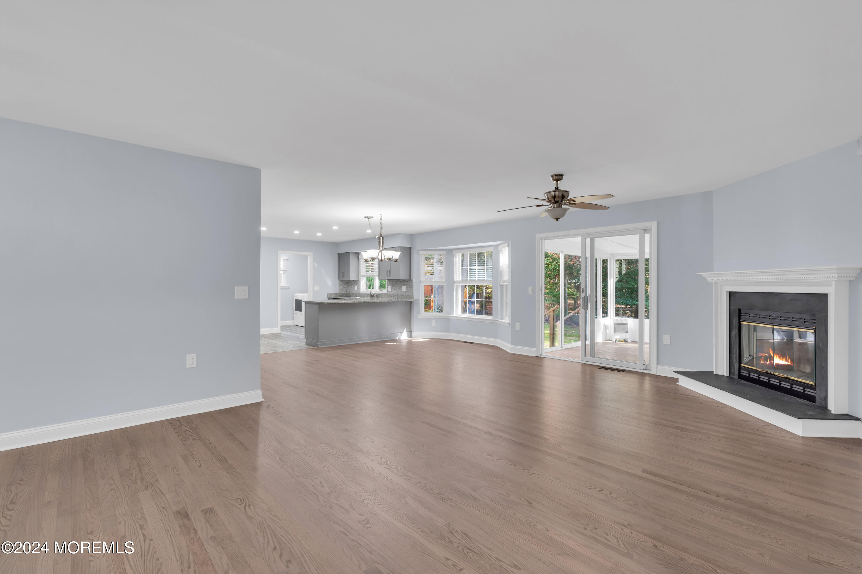 239 Sunset Drive Forked River, NJ 08731 - Photo 35 of 35 a view of an empty room with wooden floor and a fireplace