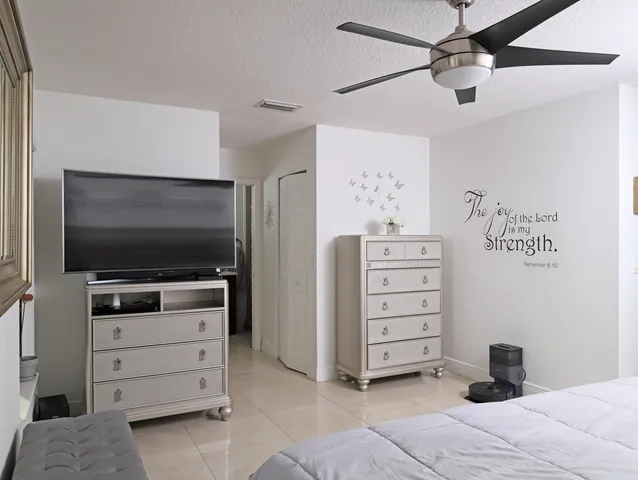 a room with furniture and flat screen tv