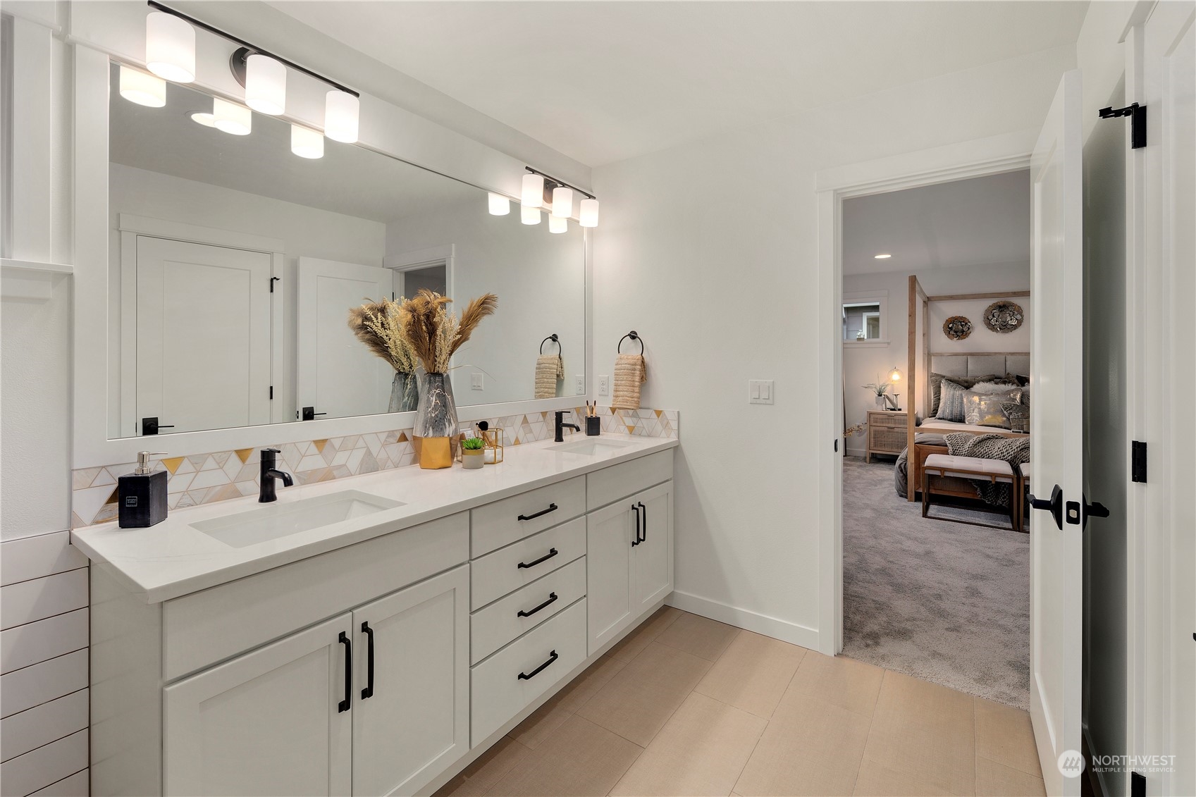 3921 211th Place Southeast Bothell, WA 98021 - Photo 21 of 28 a bathroom with a double vanity sink and a mirror