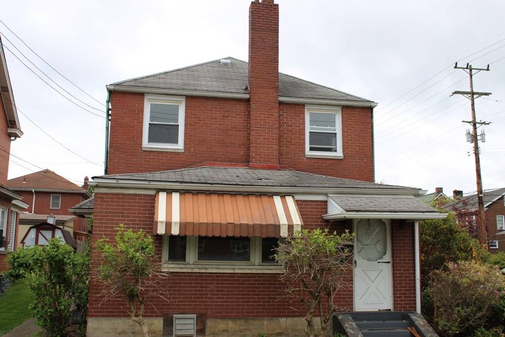 825 Liberty Street Duquesne, PA 15110 - Photo 1 of 25 a front view of a house with a yard