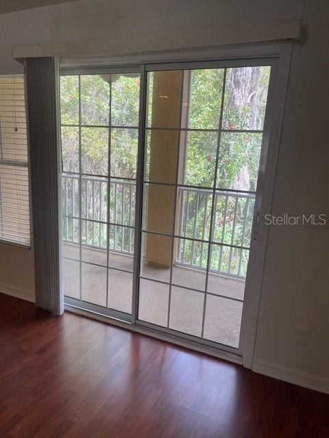 8837 White Sage Loop Lakewood Ranch, FL 34202 - Photo 11 of 22 wooden floor in an empty room with a window