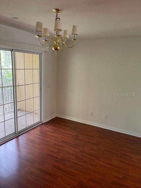 8837 White Sage Loop Lakewood Ranch, FL 34202 - Photo 13 of 22 wooden floor in an empty room with a window