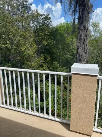 a balcony with a yard