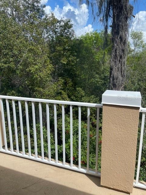 8837 White Sage Loop Lakewood Ranch, FL 34202 - Photo 18 of 22 a balcony with a yard