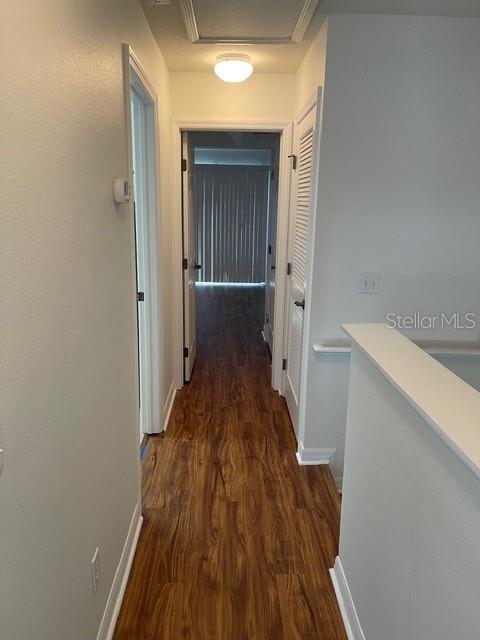 8837 White Sage Loop Lakewood Ranch, FL 34202 - Photo 19 of 22 a view of a hallway with wooden floor and staircase