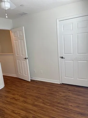 a view of room with wooden floor