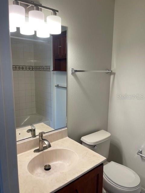 8837 White Sage Loop Lakewood Ranch, FL 34202 - Photo 21 of 22 a bathroom with a sink toilet and mirror