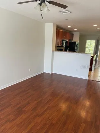 a view of a kitchen with a sink and microwave