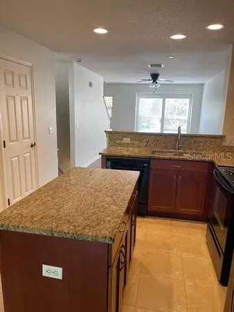 a kitchen with a sink a counter top space and appliances