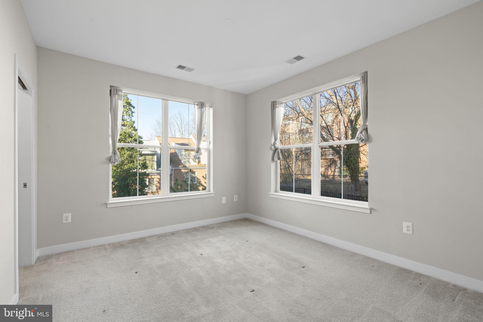 989 South Buchanan Street, Unit 312 Arlington, VA 22204 - Photo 26 of 45 an empty room with windows