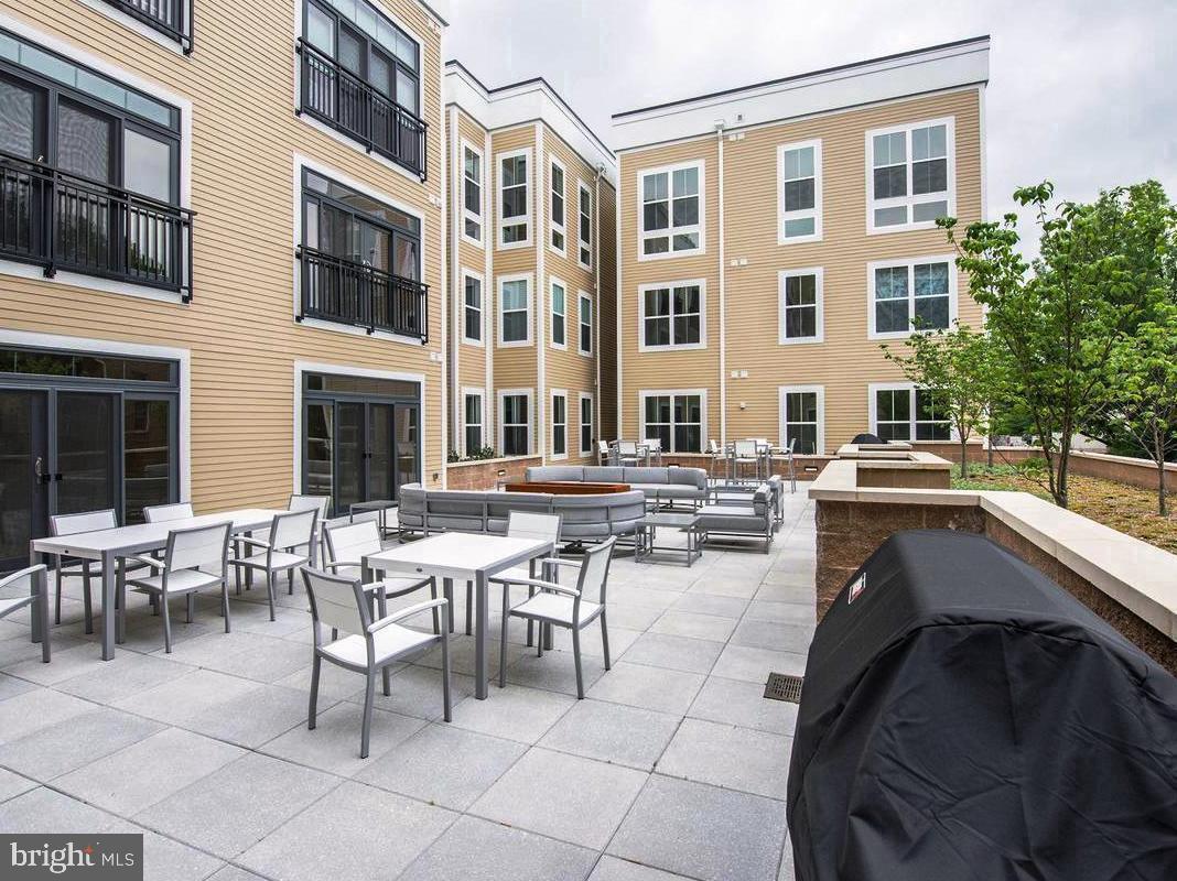 989 South Buchanan Street, Unit 312 Arlington, VA 22204 - Photo 33 of 45 a outdoor space with lots of tables and chairs