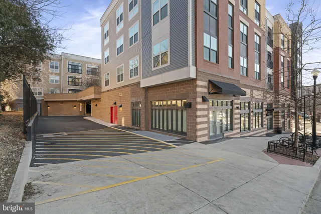 a view of a building with car parked