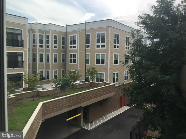 a view of a building with a garage