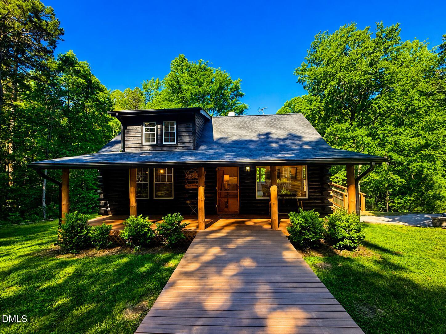 327 Shady Oak Road Roxboro, NC 27574 - Photo 60 of 62 a view of a house with a yard