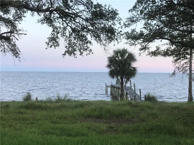 a view of a lake with a big yard