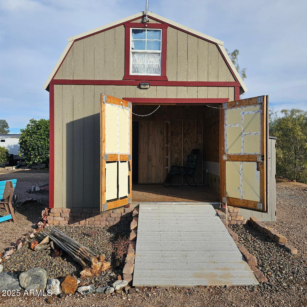 30605 Meandering Lane, Unit 151 Congress, AZ 85332 - Photo 9 of 18 a front view of a house with a yard