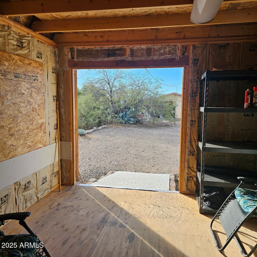 30605 Meandering Lane, Unit 151 Congress, AZ 85332 - Photo 10 of 18 a bedroom with a bed and a window