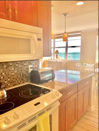 a kitchen with a stove and a sink