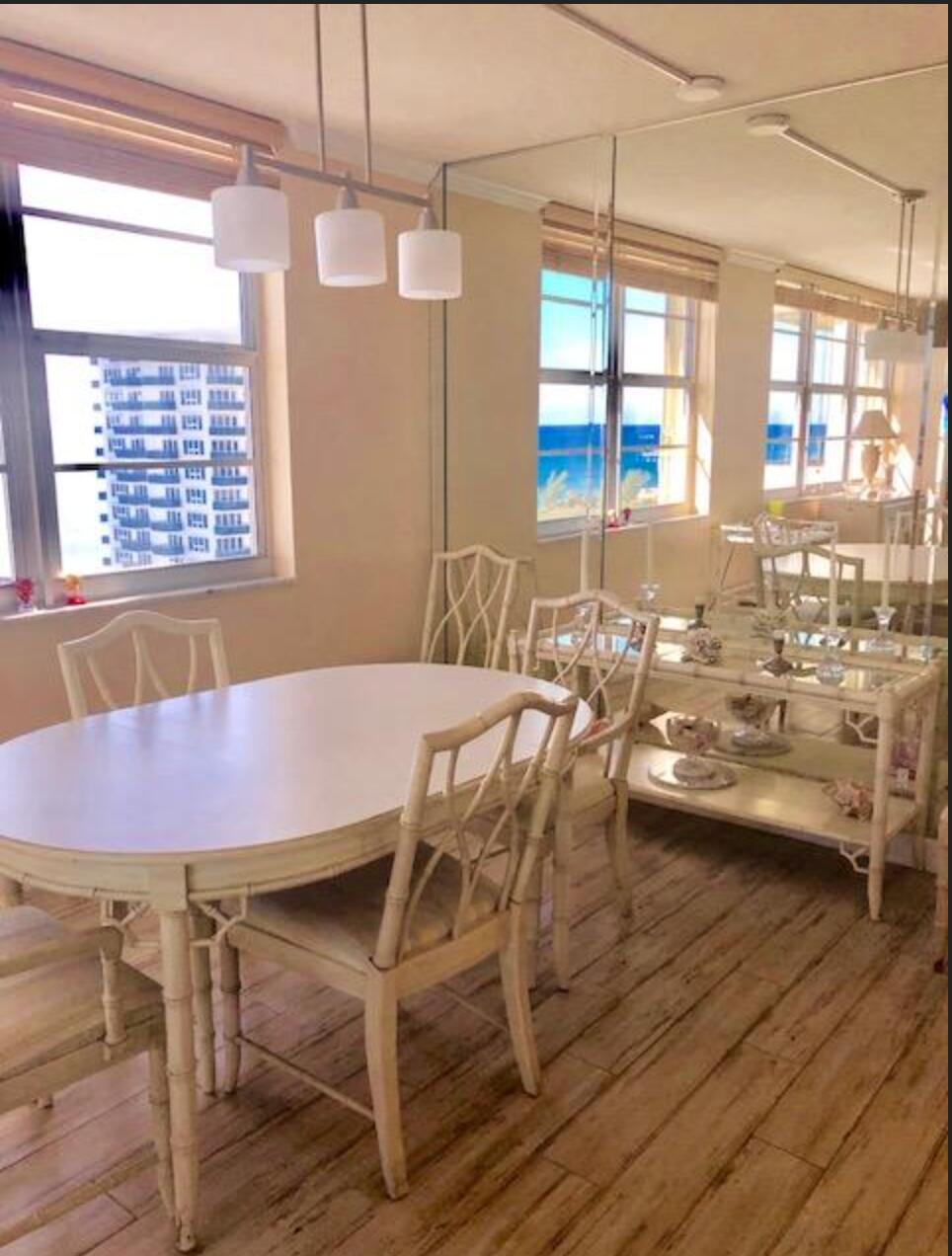 2121 North Ocean Boulevard, Unit 1208E Boca Raton, FL 33431 - Photo 16 of 61 a view of a dining room with furniture and window