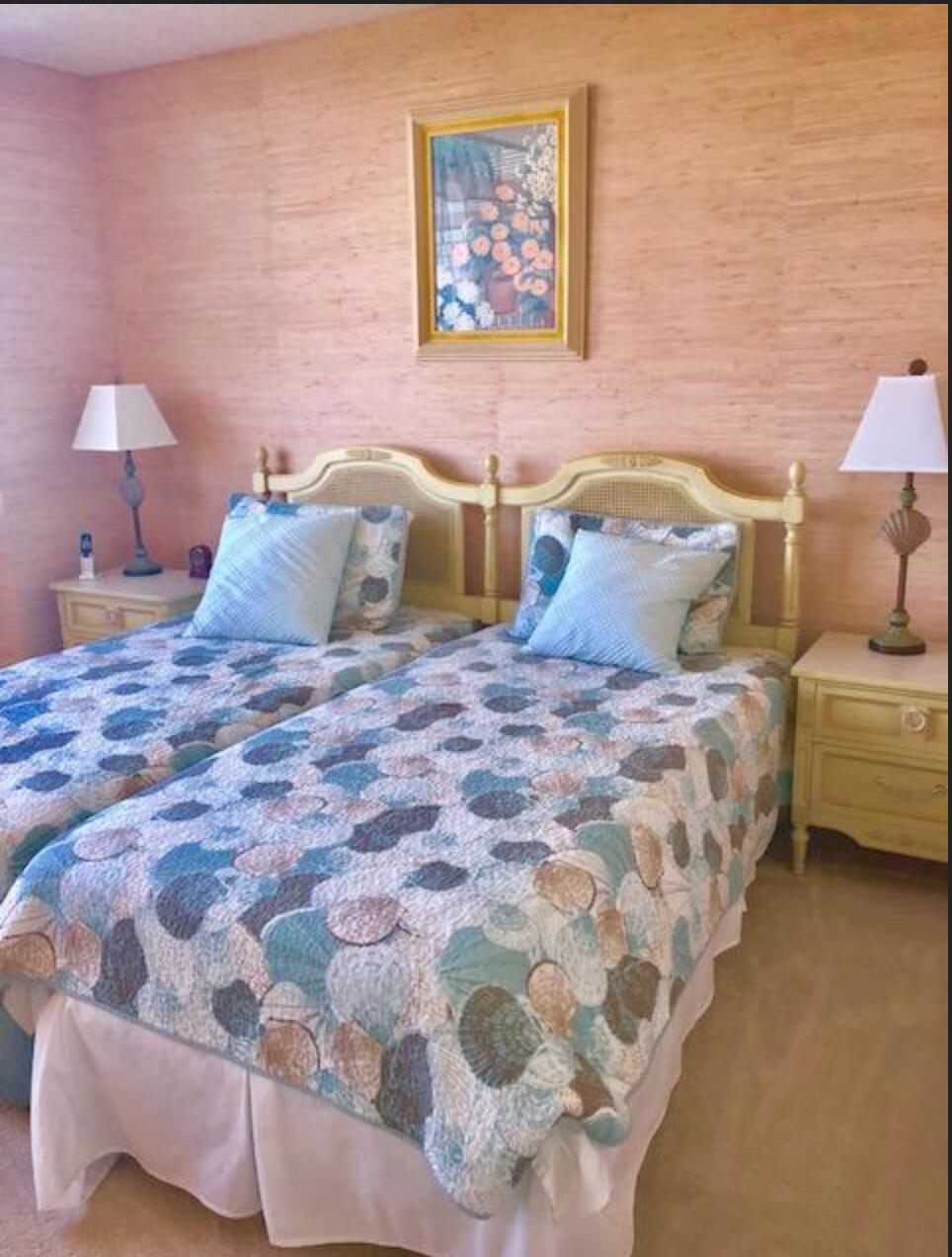 2121 North Ocean Boulevard, Unit 1208E Boca Raton, FL 33431 - Photo 20 of 61 a bedroom with a bed and a lamp