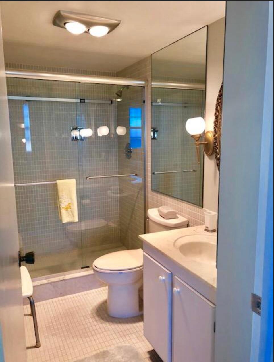 2121 North Ocean Boulevard, Unit 1208E Boca Raton, FL 33431 - Photo 21 of 61 a bathroom with a sink toilet and shower