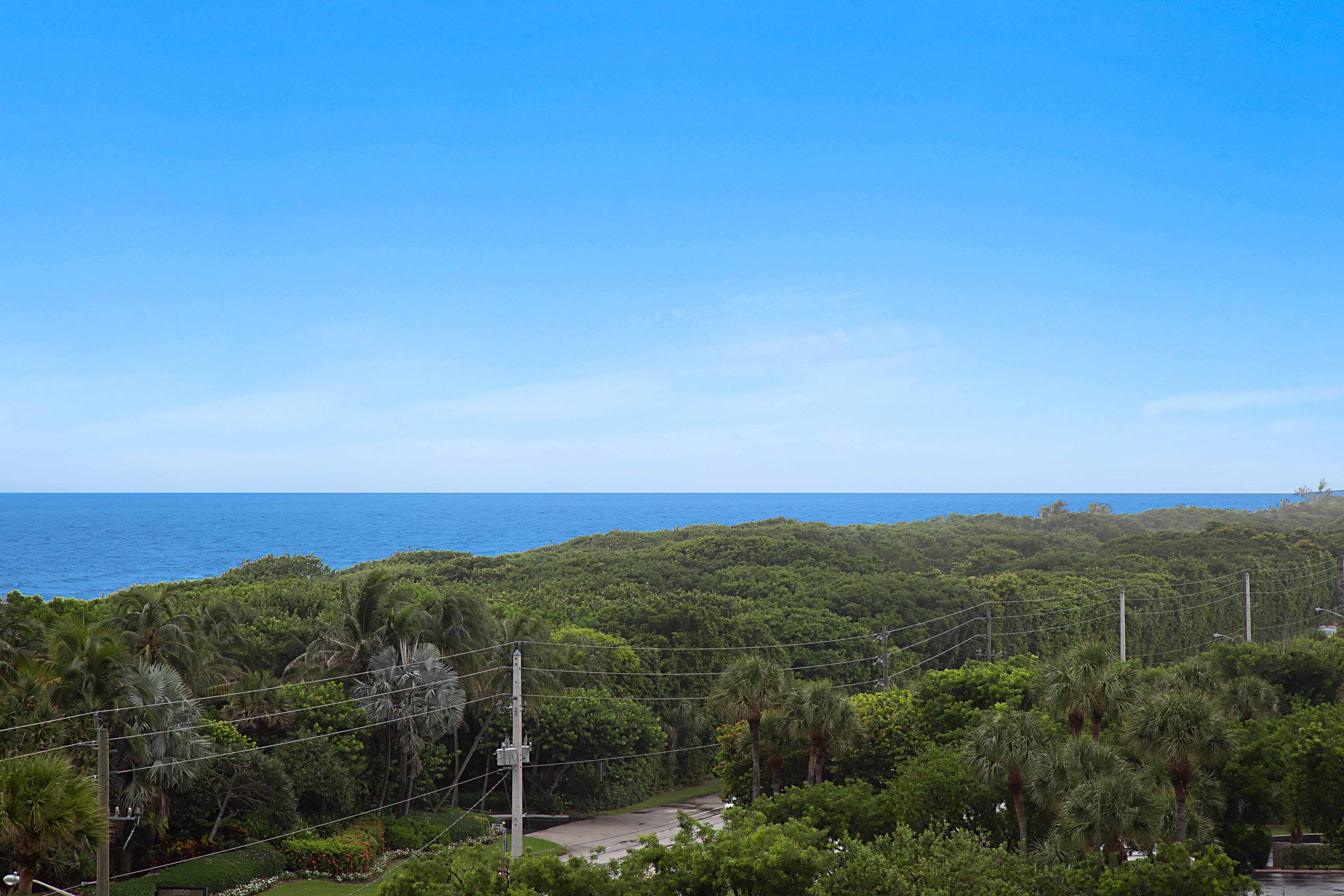 2121 North Ocean Boulevard, Unit 1208E Boca Raton, FL 33431 - Photo 54 of 61 a view of a city with lush green forest