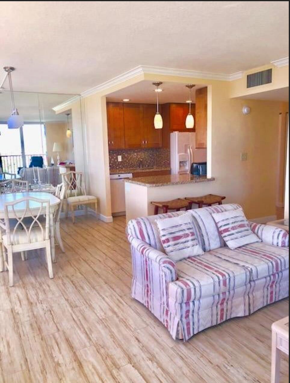 2121 North Ocean Boulevard, Unit 1208E Boca Raton, FL 33431 - Photo 6 of 61 a living room with a bed furniture and a large window