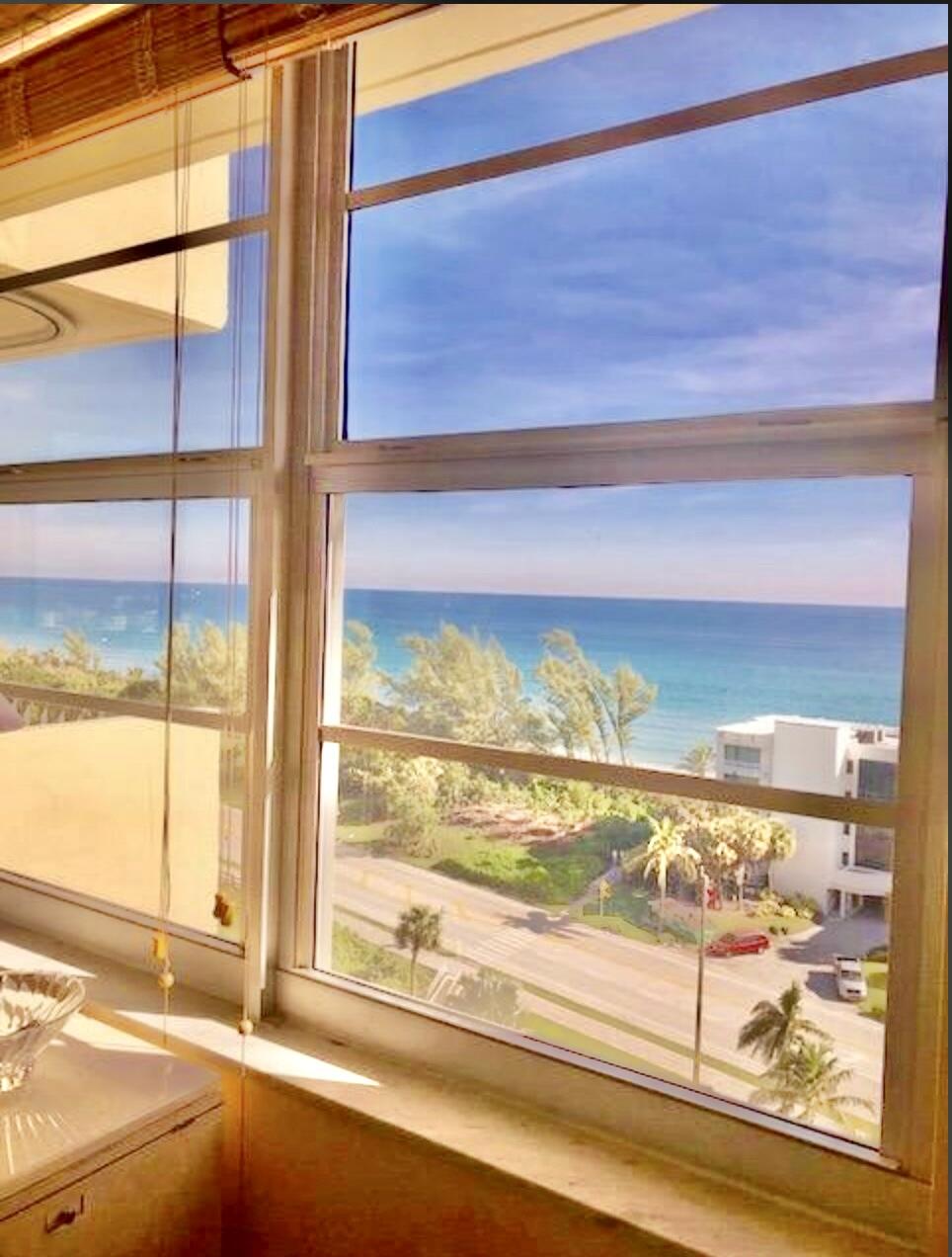 2121 North Ocean Boulevard, Unit 1208E Boca Raton, FL 33431 - Photo 8 of 61 a view of a glass door with a floor to ceiling window next to a yard