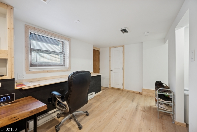 206 Brooklyn Mountain Road Hopatcong, NJ 07843 - Photo 11 of 18 a workspace with furniture hardwood and a window