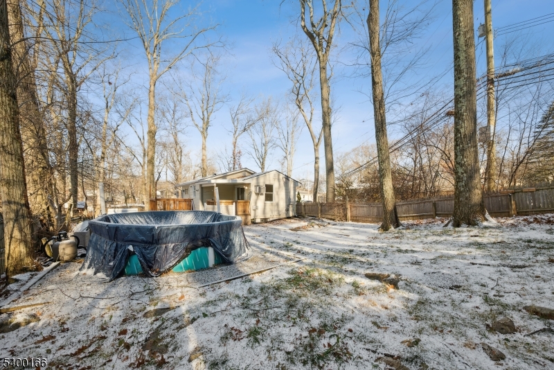 206 Brooklyn Mountain Road Hopatcong, NJ 07843 - Photo 17 of 18 a view of a yard covered with snow in the yard
