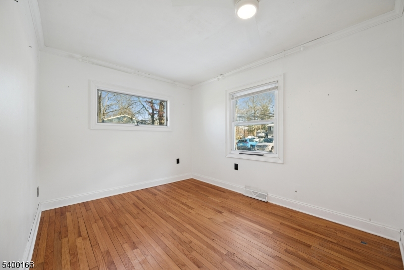 206 Brooklyn Mountain Road Hopatcong, NJ 07843 - Photo 3 of 18 a view of room with window and wooden floor