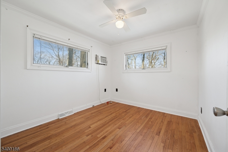 206 Brooklyn Mountain Road Hopatcong, NJ 07843 - Photo 4 of 18 a view of empty room with wooden floor