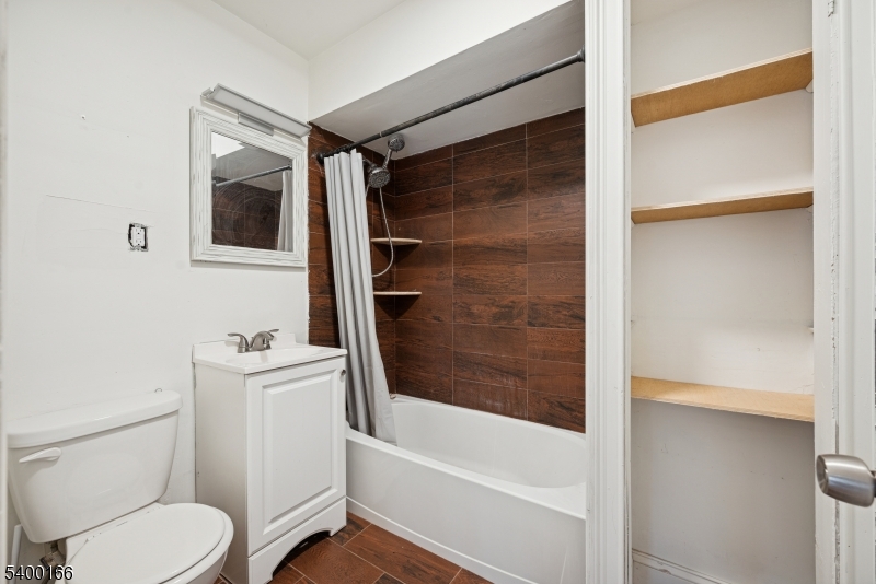 206 Brooklyn Mountain Road Hopatcong, NJ 07843 - Photo 5 of 18 a bathroom with a toilet and a bathtub