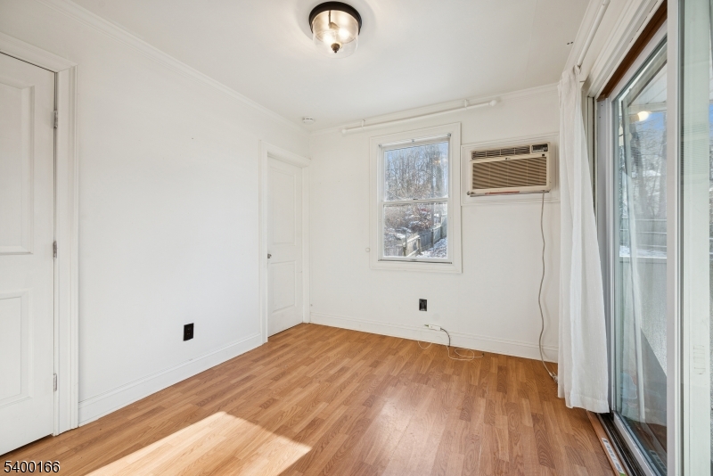 206 Brooklyn Mountain Road Hopatcong, NJ 07843 - Photo 8 of 18 a view of empty room with wooden floor