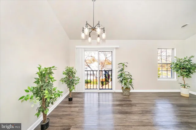 a view of entryway with wooden floor