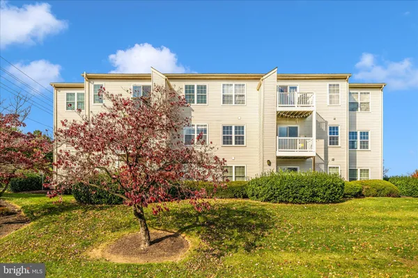 a view of a building with a garden