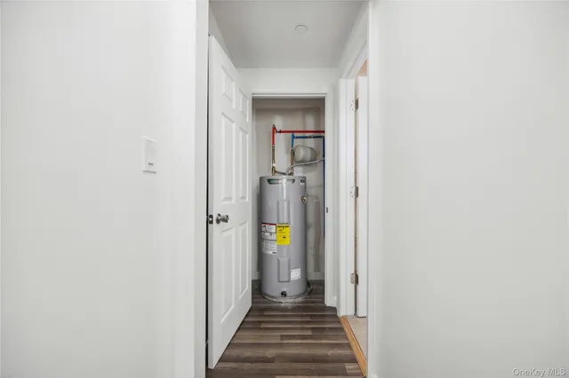 a view of a hallway view with wooden floor and staircase