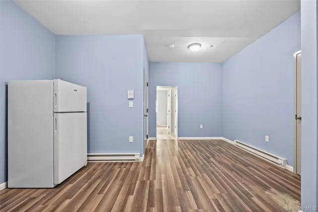 a view of a livingroom with wooden floor