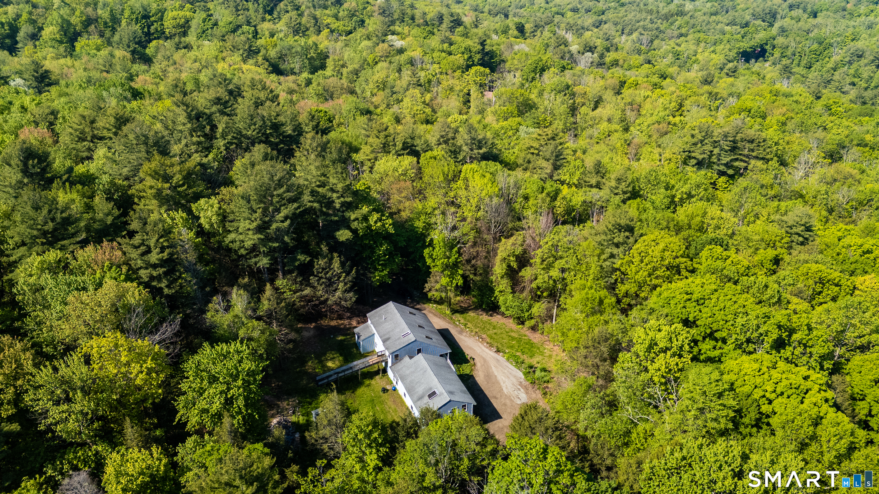 315 West Hill Road Torrington, CT 06790 - Photo 31 of 40 an aerial view of residential house with outdoor space and trees around