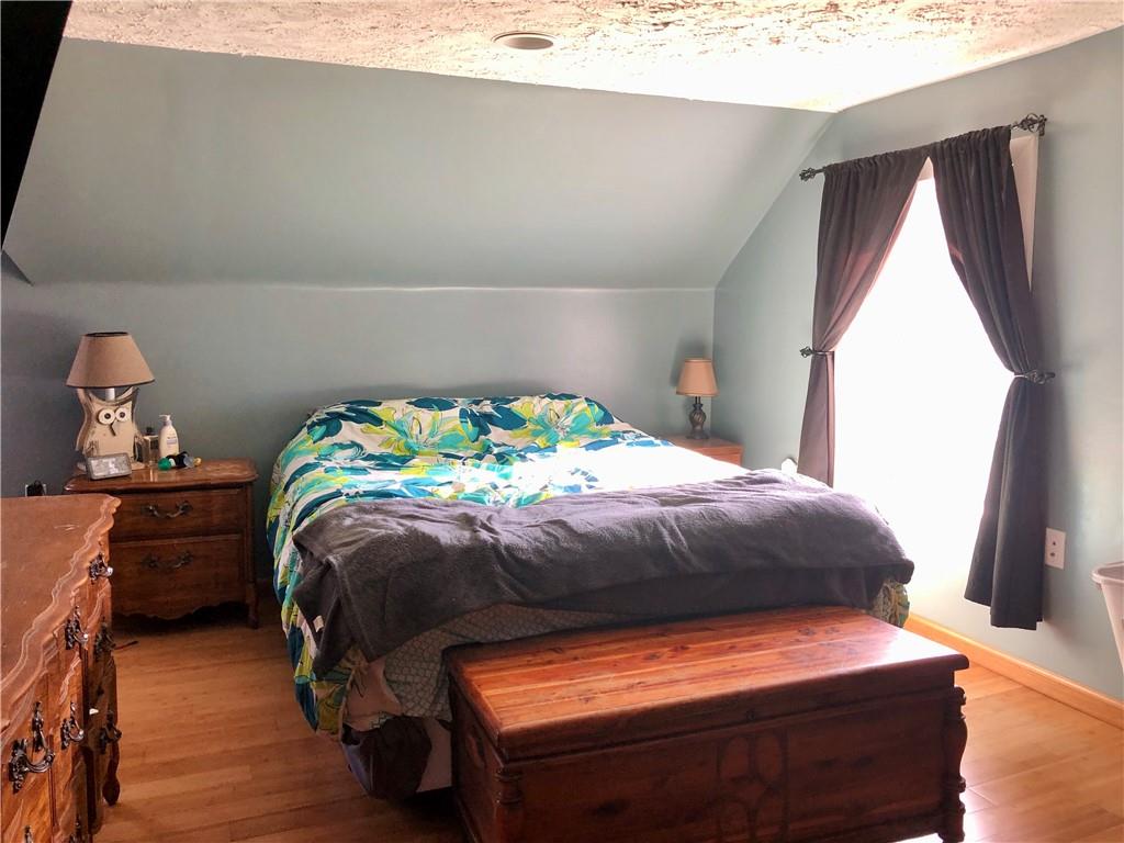 203 Lighthouse Road Commodore, PA 15729 - Photo 7 of 16 a bedroom with a bed and a window